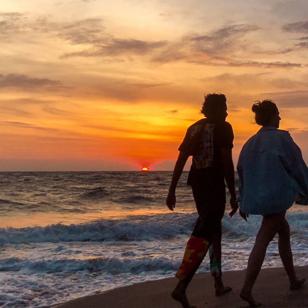 strolling along the beach and watching the sunset